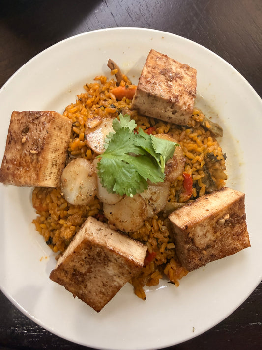 Teriyaki Tofu with water chestnuts and veggies on a bed of seasoned rice